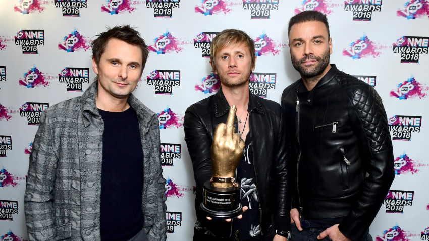 M46FWR Matt Bellamy, Chris Wolstenholme and Dominic Howard of Muse holding the award for Best International Band in the awards room at the VO5 NME Awards 2018 held at the O2 Brixton Academy, London.