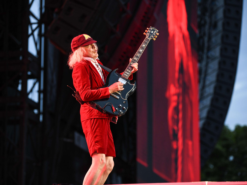 2XMG8W2 Germany ,Nurnberg, Zeppelinfeld - 27 Jul 2024 - Concert - AC/DC: Power Up Tour NurnbergImage: Angus Young, of AC/DC, preforming during their Power Up Tour at Zeppelinfeld in Nurnberg, Germany Credit: Ryan Evans/Alamy Live News