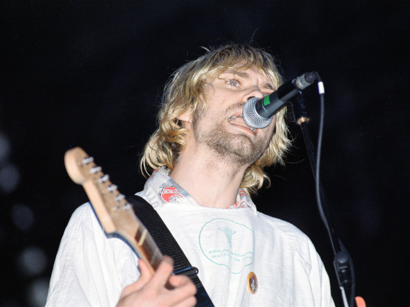 EWR28M Kurt Cobain, lead singer of Seattle-based grunge rock group Nirvana, on stage during the group's headlining performance at the Reading Festival. 30th August 1992.