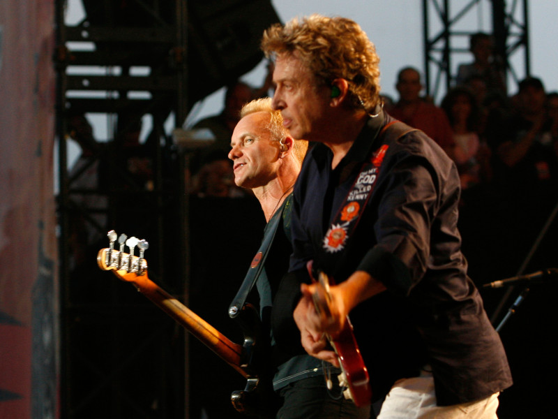 BK4NMT Guitarist Andy Summers and Sting of The Police performs at the Virgin Music Festival.