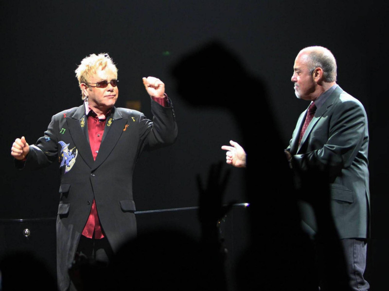 2MR1B6M Elton John and Billy Joel put on a stellar performance for the crowd on their Face To Face tour. Two of music's heavy weights dueled it out on pianos before taking a bow together. Honda Center. Anaheim, CA. 3/28/09.