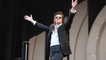 2R7NDMH Alex Turner of Arctic Monkeys performs during the first of three nights at The Emirates Stadium, London. Credit: John Barry/Alamy Live News