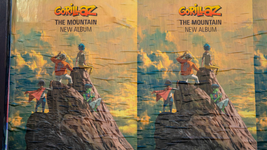 3DXT5T8 London, UK - March 2nd 2026: Promotional posters pasted on a wall in Camden, London, promoting the new album by Gorillaz entitled The Mountain.