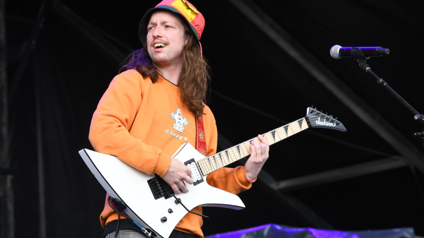 TAT5B7 Lead guitarist Brady Ebert is shown performing on stage during a "live" stand up appearance with Turnstile.