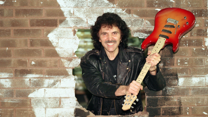 2J2TFXH Black Sabbath's Tony Iommi helps to demolish a wall at Musical Exchanges in Birmingham. The demolition is to make way for the largest guitar in the country. 29th September 1993.