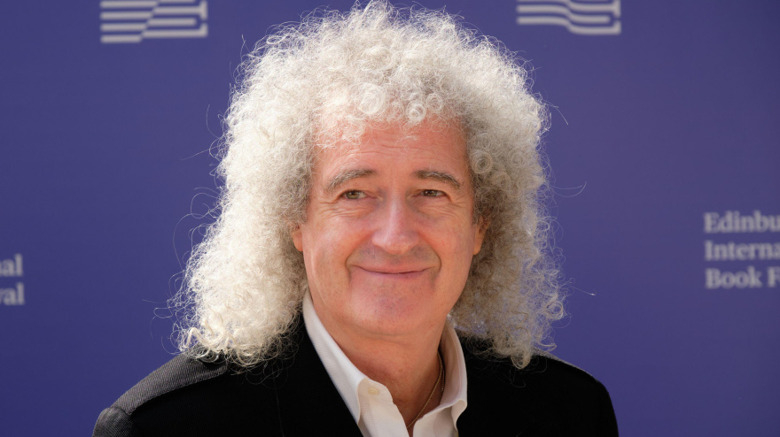 2CB7DX3 English musician, singer, songwriter, astrophysicist and photographer Brian May attends a photocall during the annual Edinburgh International Book Fes