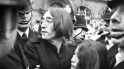 John Lennon protects Yoko Ono after crowds tried to mob them after they left a London Court Hearing Charges of Possession of Marijuana and Obstructing Police. The pair were released on bail of £100 until their trial on 28th November.London - 19th October 1968 Ref: B196_095082_0934Date: 19.10.1968Compulsory Credit: STARSTOCK/Photoshot 9th November 1966 - John Lennon and Yoko Ono meet for the first time at her exhibition at the Indica Gallery in London. Lennon remembered the date of their meeting as the 9th but many Beatles historians contend that it actually happened on the 7th, the day before the exhibition opened.
